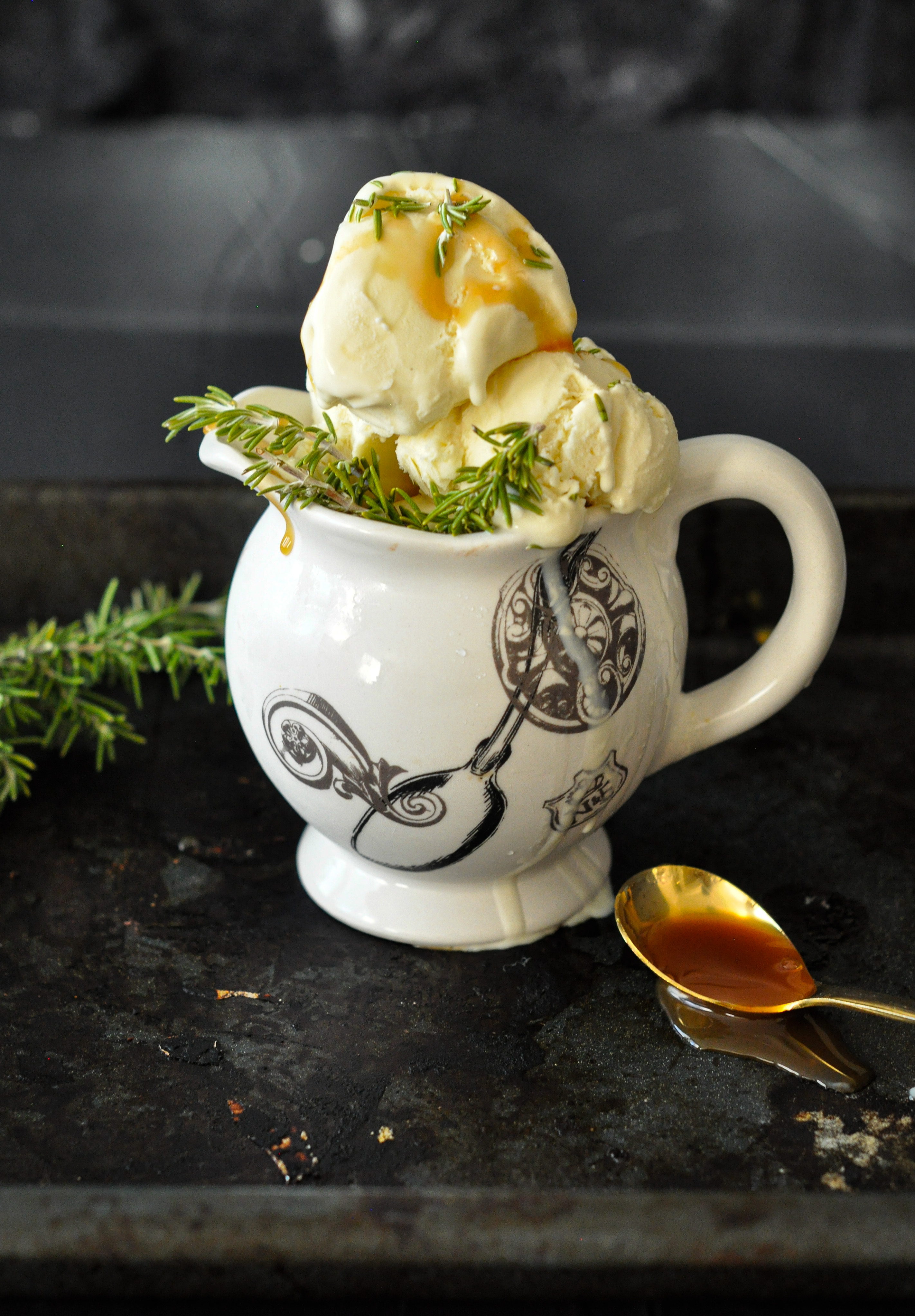 Easy no machine, no churn honey ice cream made with local honey and topped with a homemade rosemary herb syrup. A favorite summer treat that you can make with your kids at home.